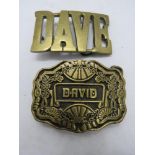 Two belt buckles, Dave and David.