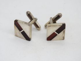 A pair of silver square form cufflinks.