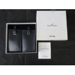 Concorde; a pair of grey leather luggage tags in original box.