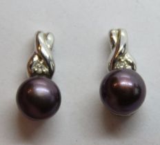 A pair of 14ct white gold black pearl stud earrings, 2.