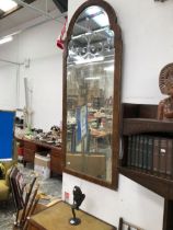 A 19th C. MIRROR WALNUT FRAMED WITH A GILT SLIP, THE ROUNDED ARCHED TOP REVERSE CUT WITH THREE