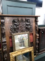 A ANTIQUE 19th CENTURY SURROUND WITH APPLIED CARVED OAK FIGURAL PANELS