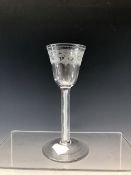 AN 18th C. WINE GLASS WITH THE BOWL ENGRAVED WITH LEAVES AND STYLISED FLOWERS PENDANT FROM DIAMOND