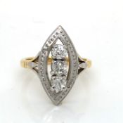 A DIAMOND MARQUISE SHAPE THREE STONE RING. THE THREE OLD CUT DIAMONDS ASSESSED AS AN AVERAGE