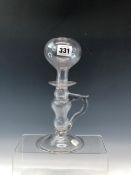 A LATE 18th/EARLY 19th C. GLASS LACE MAKERS LAMP WITH A HANDLE TO ONE SIDE OF THE HOLLOW STEM