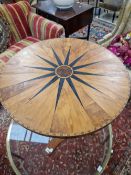 A JAMAICAN SPECIMEN WOOD TABLE, THE CIRCULAR TOP INLAID WITH A STAR, THE SPIRAL TURNED COLUMN ON A