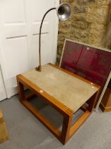 A PINE COFFEE TABLE WITH THE OATMEAL STONE TOP FITTED WITH A LAMP TO ONE END WITH A FLEXIBLE