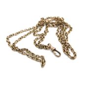 A VINTAGE FOB WATCH CHAIN. THE CONTINUIOUS CHAIN WITH AN ATTACHED DOG TOOTH CLASP. UNHALLMARKED,