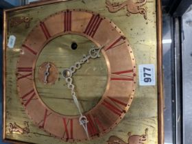 AN ARTS AND CRAFTS COPPER MOUNTED BRASS CASED WEIGHT DRIVEN WALL CLOCK WITH SUBSIDIARY SECONDS