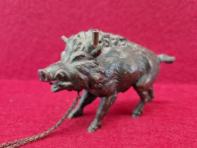 AN ANTIQUE PATINATED BRONZE WILD BOAR FORM DESK LIGHTER 11 cm LONG.