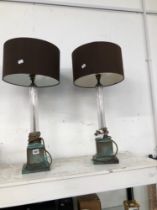A PAIR OF BRASS AND GLASS LARGE TABLE LAMPS.