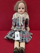 AN ARMAND MARSEILLE 370 BISQUE HEADED DOLL WITH FIXED EYES AND OPEN MOUTH. H 47cms.