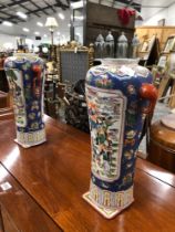 A PAIR OF CHINESE BLUE GROUND VASES WITH FIGURE RESERVES AND RED ELEPHANT MASK HANDLES