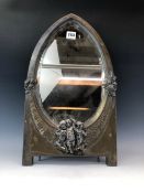 A WMF SILVER PLATE EASEL BACK FRAMED BEVELLED GLASS MIRROR, THE EGG SHAPED GLASS FLANKED BY