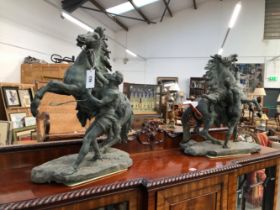 AN IMPRESSIVE LATE 19TH CENTURY PAIR OF PATINATED BRONZE MODELS OF THE MARLY HORSES, CAST AFTER