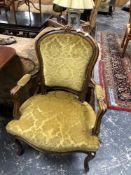 A PAIR OF FRENCH CARVED FAUTEUILS UPHOLSTERED IN OLIVE GREEN DAMASK