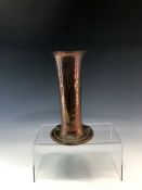 AN ARTS AND CRAFTS HAMMERED COPPER VASE INSET WITH THREE MOTHER OF PEARL ROUNDELS ON THE SPREADING
