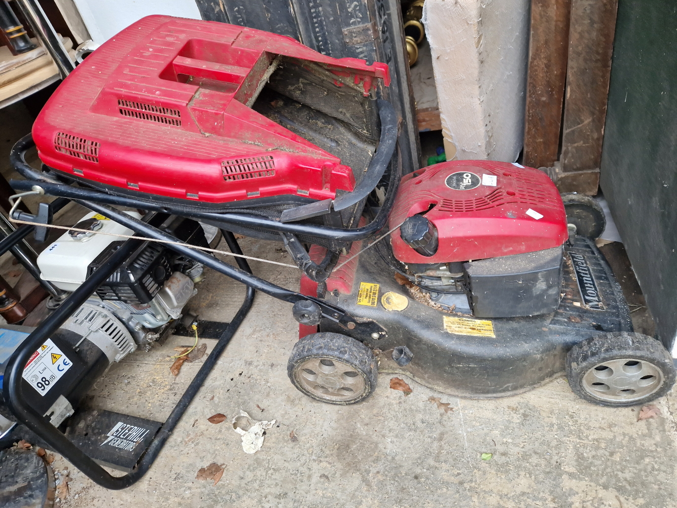 A MOUNTFIELD LAWN MOWER.