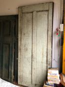 A LARGE PAIR OF ANTIQUE PANEL DOORS