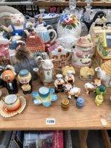 A QUANTITY OF NOVELTY TEAPOTS ETC.