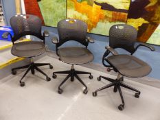 A SET OF THREE HERMAN MILLER "TASK" OFFICE ARMCHAIRS LABELLED TO UNDERSIDE OF SEATS.