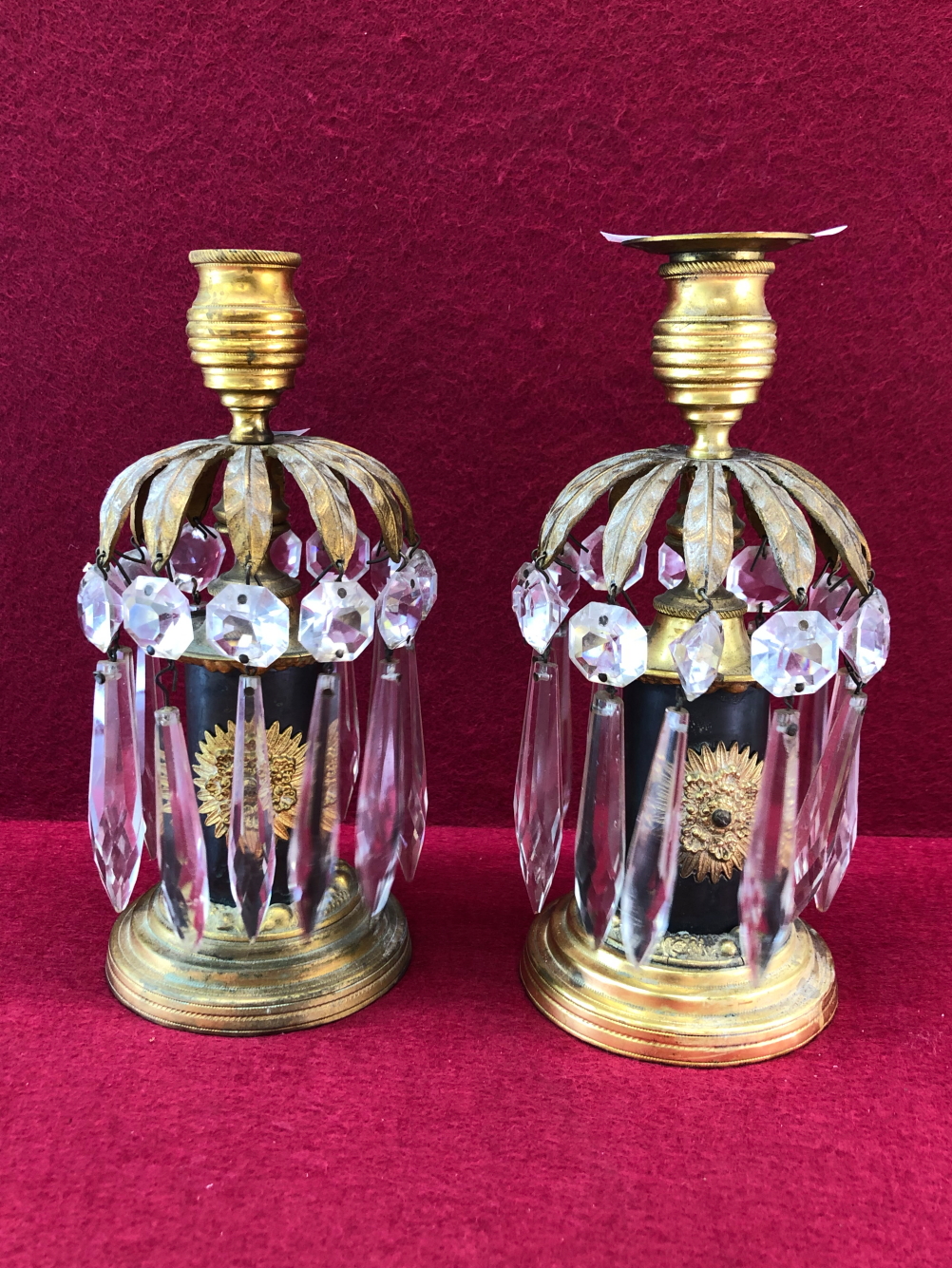 A PAIR OF 19TH CENTURY GILT BRASS MOUNTED CANDLE STICKS WITH GLASS LUSTRE DROPS