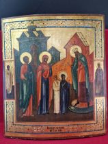A RUSSIAN ICON PAINTED WITH SAINTS BEING GREETED AT THE DOORS OF A TEMPLE. 36 x 31cms.