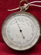 A DOLLOND POCKET BAROMETER NUMBERED 12179 ON THE CIRCULAR SILVERED DIAL. Dia. 7cms.