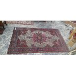 AN ANTIQUE PERSIAN KIRMAN RUG. 225 x 139cms