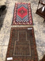 AN ANTIQUE BELOUCH PRAYER RUG. 104 x 81cms TOGETHER WITH A KNOTTED RUG OF TURKISH DESIGN. 160 X