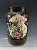 A LATE 19th C. JAPANESE LACQUERED STONEWARE VASE PAINTED WITH PANELS OF FLOWERS ALTERNATING WITH