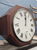 A WALL MOUNTING GPO TIMEPIECE WITH ROUND FACES ON TWO SIDES OF THE OCTAGONAL MAHOGANY CASE. H