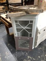 TWO WOODEN BARS FROM THE ROUND ARCH TOP OF A WINDOW FRAME