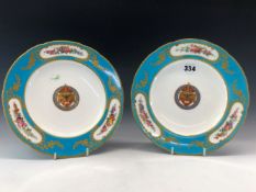A PAIR OF 19th C. MINTON SEVRES STYLE ARMORIAL PLATES, THE ECCLESIASTICAL ARMS ENCLOSED BY FLOWER