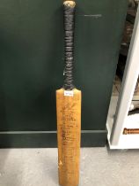 A WISDENS EXCELLER CRICKET BAT SIGNED BY THE AUSTRALIAN AND ENGLAND TEST CRICKET TEAMS OF 1926