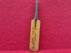 A RARE ROWNTREES CACHOUS TIN PLATE CRICKET BAT. WITH REMOVABLE LID. 11cms.