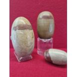 THREE INDIAN SHIVA LINGAM STONE OF LARGE SIZE EACH OF GREYISH STONE WITH RED LINE INCLUSIONS.