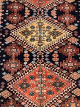 A TURKISH RUG OF CAUCASIAN DESIGN. 176 x 117cms