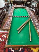 A LARGE FOLD OVER BAGATELLE TABLE