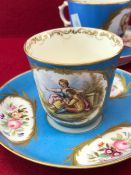 A SET OF FOUR 19th C. SEVRES TURQUOISE GROUND CUPS AND SAUCERS PAINTED WITH COUPLES IN LANDSCAPES