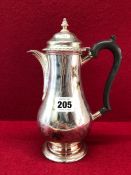 A SILVER BALUSTER COFFEE POT BY TESSIERS, LONDON 1934, THE HINGED COVER WITH A GADROONED RIM ABOVE