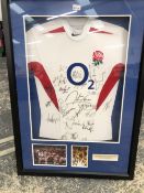 A RARE 2003 RUGBY WORLD CUP CHAMPIONSHIP ENGLAND SHIRT SIGNED BY THE ENGLAND WINNING TEAM.