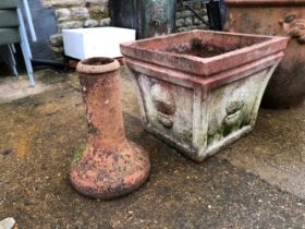 A LARGE SQUARE TERRECOTTA PLANTER AND A TERRECOTTA FORCER.