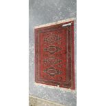 A MACHINE MADE RUG OF CAUCASIAN DESIGN. 200 x 140cms