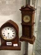 A TIMEPIECE IN A LANCET CASE AND ANOTHER IN A MINIATURE LONGCASE CLOCK CASE