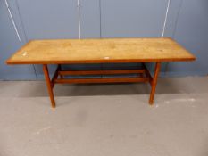 A MID CENTURY DANISH TEAK COFFEE TABLE THE RECTANGULAR TOP ON SQUARE LEGS JOINED BY A PAIR OF