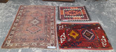 AN ANTIQUE PERSIAN AFSHAR RUG. 167 x 123cms TOGETHER WITH TWO TRIBAL BAG FACES (3)