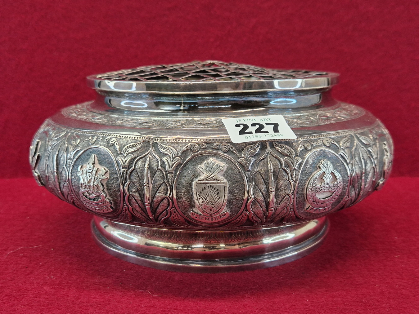 A BURMESE WHITE METAL 1960 PRESENTATION ROSE BOWL AND GRILLE COVER, THE BUN SHAPED SIDES WITH TOWN