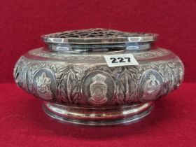 A BURMESE WHITE METAL 1960 PRESENTATION ROSE BOWL AND GRILLE COVER, THE BUN SHAPED SIDES WITH TOWN