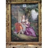 A 19th C. GILT FRAMED PORCELAIN PLAQUE PAINTED WITH TWO LADIES SEATED BY STATUARY UNTYING A LOVE